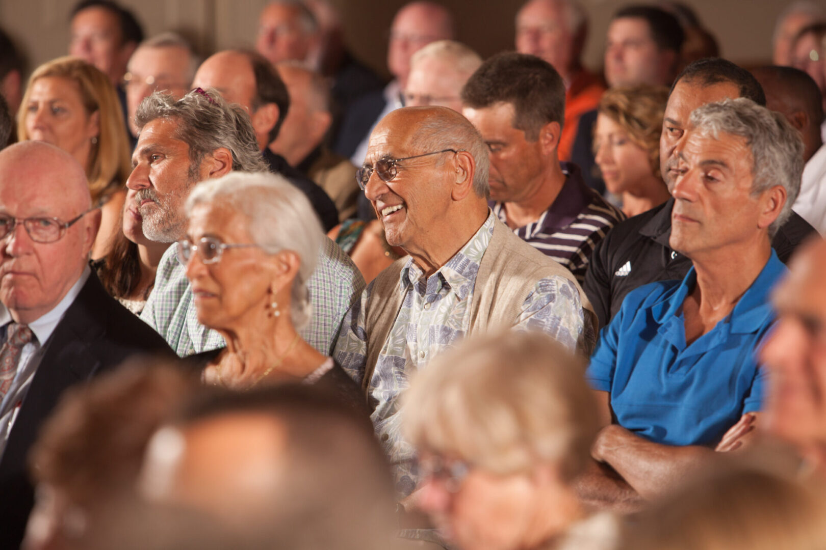 A group of people sitting in a room.