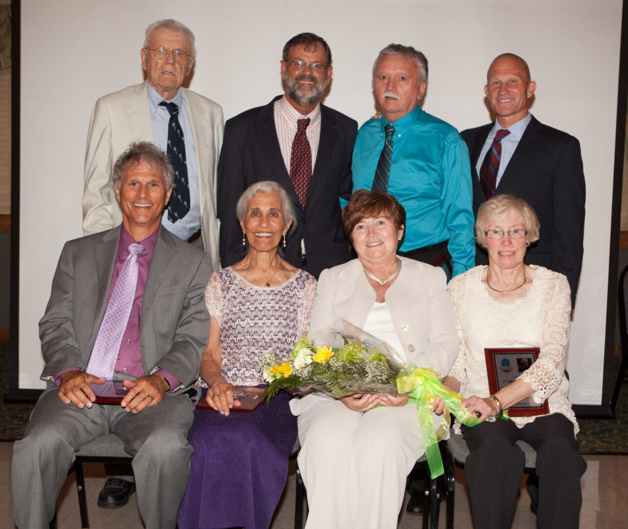 A group of people that are sitting down