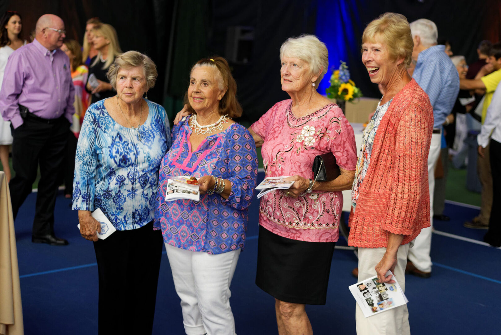 A group of women standing next to each other.