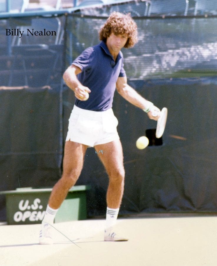 A man swinging at a tennis ball with his racket.